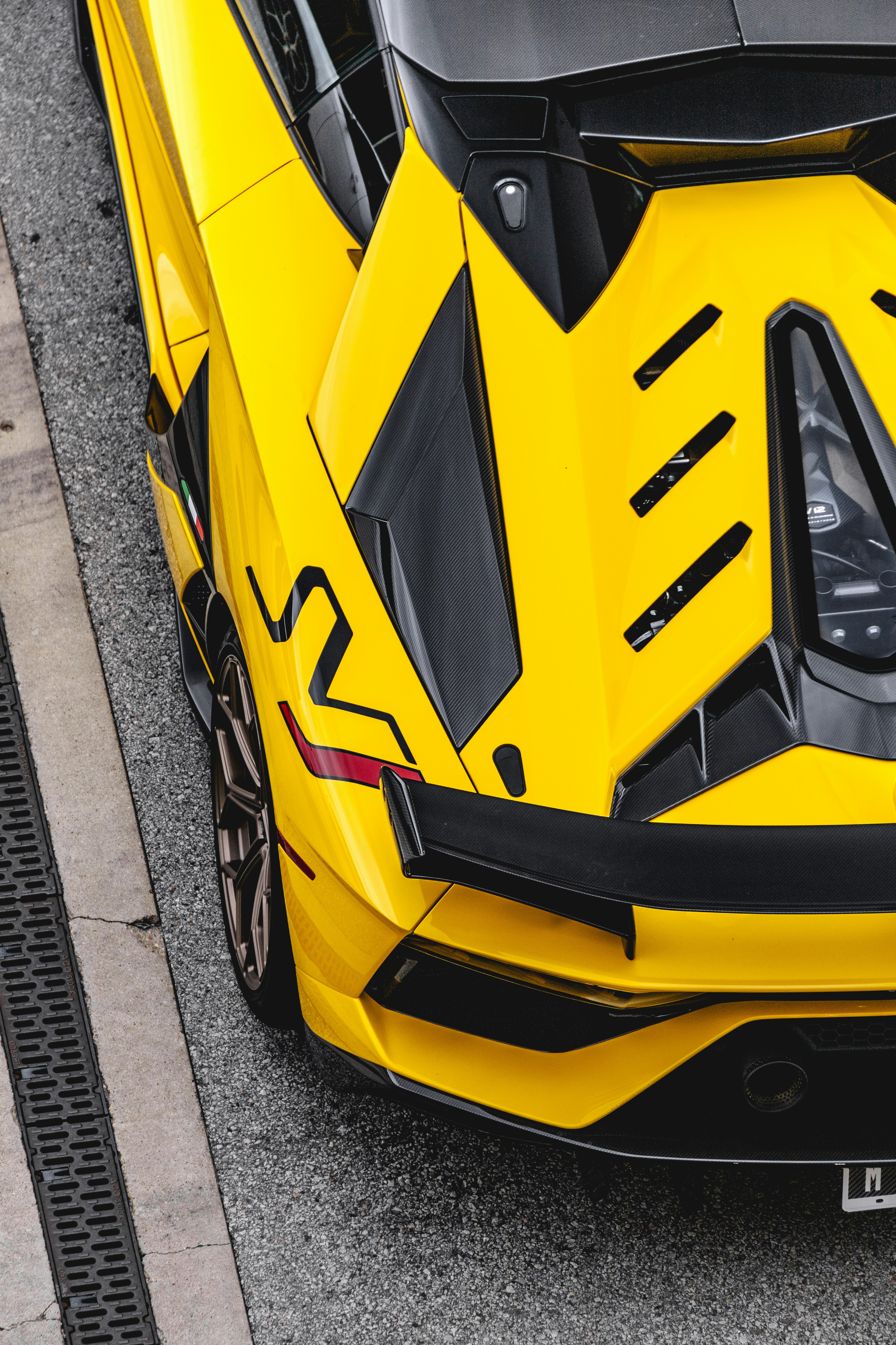 yellow and black car on road